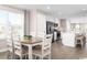 Open-concept dining area connected to a modern kitchen, perfect for entertaining guests at 532 Ryegrass Way # 0029B, Murrells Inlet, SC 29576