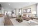 Cozy living room featuring a comfortable sofa, stylish decor, and ample natural light at 532 Ryegrass Way # 0029B, Murrells Inlet, SC 29576