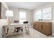 Bright office space featuring a wooden desk, a matching credenza, and large framed wall art at 532 Ryegrass Way # 0029B, Murrells Inlet, SC 29576