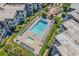Gorgeous aerial view of a community pool surrounded by lush landscaping and lounge areas at 5601 N Ocean Blvd. # E-304, Myrtle Beach, SC 29577