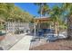 Outdoor barbecue area with grills, picnic tables, and manicured landscaping for community gatherings at 5601 N Ocean Blvd. # E-304, Myrtle Beach, SC 29577