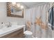 Charming bathroom featuring a stylish vanity and a beach-themed shower curtain at 5601 N Ocean Blvd. # E-304, Myrtle Beach, SC 29577