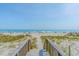 Picturesque beach access via a charming wooden walkway at 5601 N Ocean Blvd. # E-304, Myrtle Beach, SC 29577