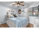 Inviting bedroom with seaside decor features a large bed and a window with natural light at 5601 N Ocean Blvd. # E-304, Myrtle Beach, SC 29577