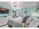Relaxing bedroom with seaside accents boasts a ceiling fan and sliding glass doors to a balcony at 5601 N Ocean Blvd. # E-304, Myrtle Beach, SC 29577