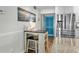 Cozy kitchen nook offers a bistro table with seating and stainless steel refrigerator at 5601 N Ocean Blvd. # E-304, Myrtle Beach, SC 29577