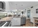 Well-lit kitchen boasts granite countertops, stainless steel appliances, and a breakfast bar with pendant lighting at 5601 N Ocean Blvd. # E-304, Myrtle Beach, SC 29577