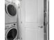 Efficient laundry space with a stacked washer and dryer, perfect for modern living at 5601 N Ocean Blvd. # E-304, Myrtle Beach, SC 29577