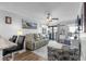 Living room featuring comfortable seating, ceiling fan, and sliding glass doors to a balcony at 5601 N Ocean Blvd. # E-304, Myrtle Beach, SC 29577