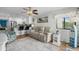 Comfortable living room and adjacent dining area featuring hardwood flooring and white walls at 5601 N Ocean Blvd. # E-304, Myrtle Beach, SC 29577