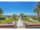 Spectacular ocean view framed by lush landscaping and inviting benches at 5601 N Ocean Blvd. # E-304, Myrtle Beach, SC 29577