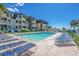Refreshing pool surrounded by comfortable lounge chairs for relaxation and enjoyment at 5601 N Ocean Blvd. # E-304, Myrtle Beach, SC 29577
