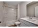 This bathroom features a tub-shower, vanity with sink and modern fixtures at 572 Woodland Farms Circle, Aynor, SC 29511