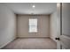 This bedroom offers neutral walls, carpet flooring, and a window at 572 Woodland Farms Circle, Aynor, SC 29511