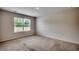 Bright bedroom offering a neutral color scheme and a large window for ample light at 572 Woodland Farms Circle, Aynor, SC 29511