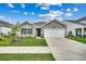 Charming single-story home featuring a two-car garage and beautifully landscaped front yard at 572 Woodland Farms Circle, Aynor, SC 29511
