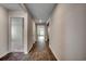 Hallway with beautiful wood-look flooring, leading to bedrooms and living areas at 572 Woodland Farms Circle, Aynor, SC 29511