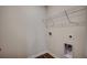 This is a laundry room with wood-look flooring and a wire rack for storage at 572 Woodland Farms Circle, Aynor, SC 29511