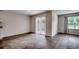 Open-concept living room featuring durable wood-look flooring and natural light at 572 Woodland Farms Circle, Aynor, SC 29511