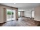 Bright living space with sliding glass doors leading to the outdoors and wood-look flooring at 572 Woodland Farms Circle, Aynor, SC 29511