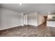 Spacious living room featuring sleek wood-look flooring and access to the kitchen area at 572 Woodland Farms Circle, Aynor, SC 29511