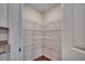Spacious pantry with multiple rows of white wire shelving at 572 Woodland Farms Circle, Aynor, SC 29511