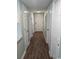 A hallway with wood-style flooring that leads to the front door and several rooms at 5905 S Kings Hwy. # 314-B, Myrtle Beach, SC 29575