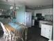 A well-lit kitchen area with modern appliances and a dining table is conveniently located near the kitchen at 5905 S Kings Hwy. # 314-B, Myrtle Beach, SC 29575