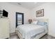 Bedroom with a door to the outside, light blue bedspread, and wood-look floors at 6001-1872 S Kings Hwy., Myrtle Beach, SC 29575
