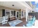 Inviting covered patio with comfortable seating and an outdoor dining area at 6001-1872 S Kings Hwy., Myrtle Beach, SC 29575