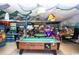 Interior view of an arcade and game room featuring various arcade games and pool tables at 6001-1872 S Kings Hwy., Myrtle Beach, SC 29575