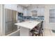 Modern kitchen with stainless steel appliances, a center island, and ample counter space for cooking and entertaining at 6001-1872 S Kings Hwy., Myrtle Beach, SC 29575