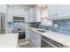 Bright kitchen with modern appliances, ample counter space, and stylish backsplash for easy meal prep at 6001-1872 S Kings Hwy., Myrtle Beach, SC 29575