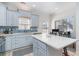 Well-lit kitchen with a center island, stainless steel appliances, and ample counter space for cooking and gathering at 6001-1872 S Kings Hwy., Myrtle Beach, SC 29575
