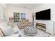Comfortable living room showcasing a large television, fireplace, and plush seating for cozy nights in at 6001-1872 S Kings Hwy., Myrtle Beach, SC 29575