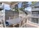 Outdoor dining area with table and chairs on a deck at 6001-1872 S Kings Hwy., Myrtle Beach, SC 29575