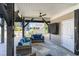 Comfortable outdoor seating area with ceiling fan and covered television for relaxing entertainment at 6001-1872 S Kings Hwy., Myrtle Beach, SC 29575