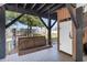 Relaxing outdoor swing on the covered porch area of the home at 6001-1872 S Kings Hwy., Myrtle Beach, SC 29575