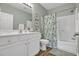 Bathroom with a shower/tub combo, single sink vanity and stylish decor at 601 Hillside Dr. N # 1405, North Myrtle Beach, SC 29582