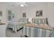 Bright and airy bedroom featuring twin beds with cozy beach-themed decor and a window with blinds at 601 Hillside Dr. N # 1405, North Myrtle Beach, SC 29582