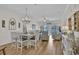 Cozy dining area with stylish decor, a chandelier, and natural light, perfect for Gathering meals at 601 Hillside Dr. N # 1405, North Myrtle Beach, SC 29582