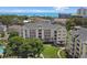 Aerial view of a charming condo building with balconies, set amongst lush greenery and the ocean at 601 Hillside Dr. N # 1405, North Myrtle Beach, SC 29582