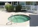 Close-up of a pristine community hot tub with clear water and safety signage at 601 Hillside Dr. N # 1405, North Myrtle Beach, SC 29582