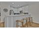 Stylish kitchen with white cabinetry, breakfast bar, and stainless steel appliances at 601 Hillside Dr. N # 1405, North Myrtle Beach, SC 29582