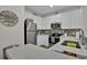 Modern kitchen showcasing stainless steel appliances, white cabinets, and backsplash at 601 Hillside Dr. N # 1405, North Myrtle Beach, SC 29582