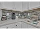 Kitchen with quartz counters, stainless appliances and attractive backsplash at 601 Hillside Dr. N # 1405, North Myrtle Beach, SC 29582