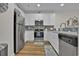 Bright kitchen features stainless appliances, tile backsplash and ample cabinet space at 601 Hillside Dr. N # 1405, North Myrtle Beach, SC 29582