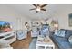 Bright living room boasts coastal decor, wood floors, and comfortable seating at 601 Hillside Dr. N # 1405, North Myrtle Beach, SC 29582