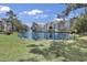 Enjoy the serene beauty of the pond and lush landscaping surrounding the property at 601 Hillside Dr. N # 1405, North Myrtle Beach, SC 29582