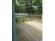 View of a wooden back deck with a wooden railing and a view of the backyard at 615 Burcale Road Circle, Myrtle Beach, SC 29579